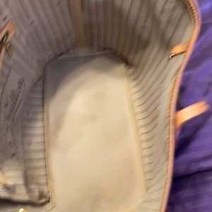 This bag is i great condition no rip no tears there is a water mark inside